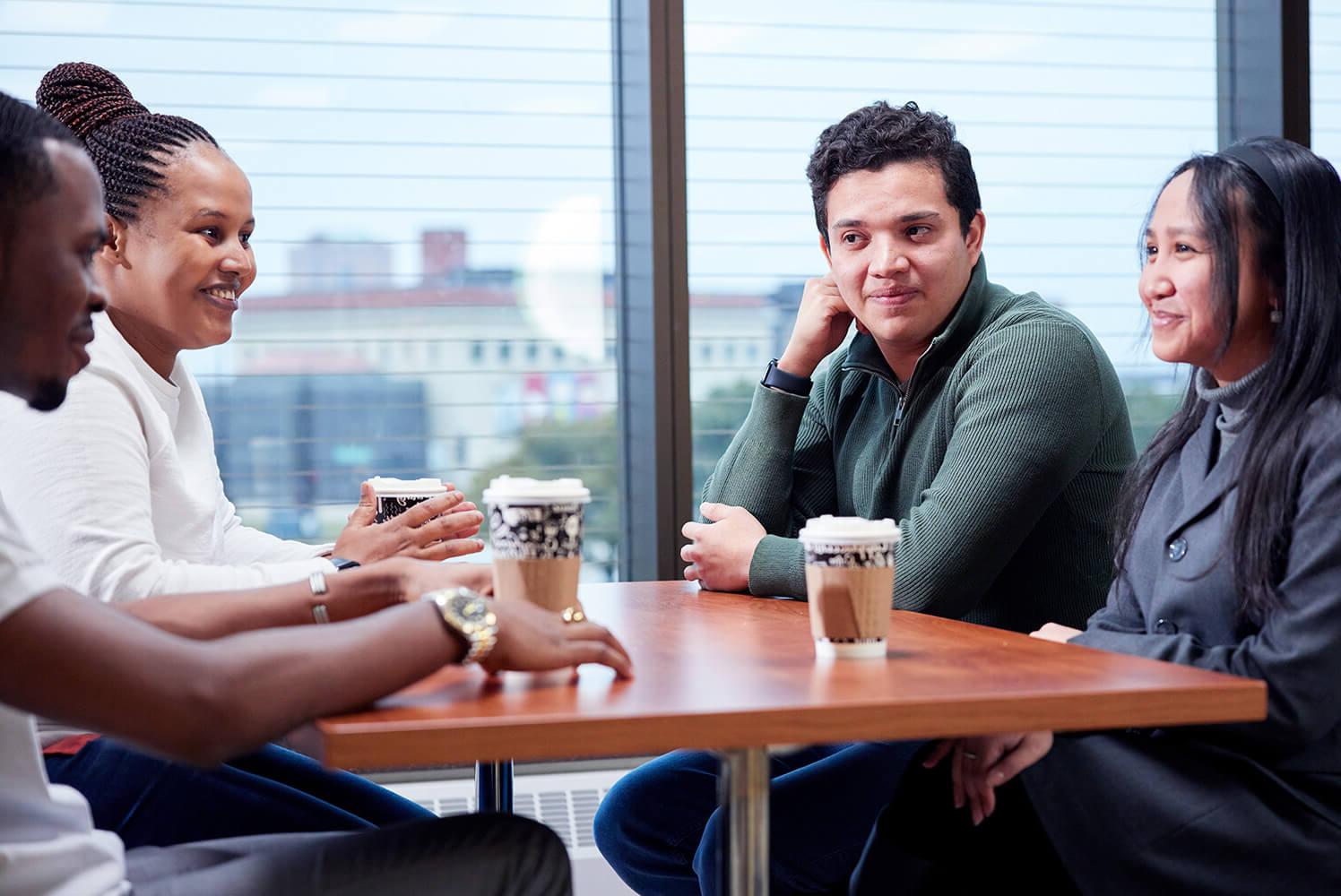 Group drinking coffee with a view of the city